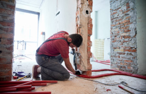 male worker restoring a damaged home