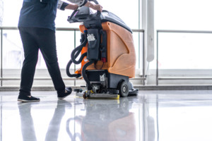 surface cleaning professional using a floor cleaning machine